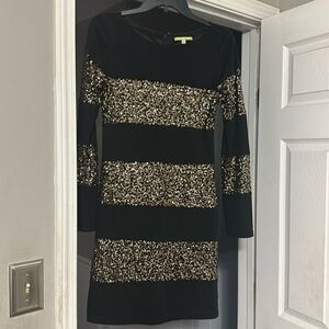 Black and gold sequin dress.
